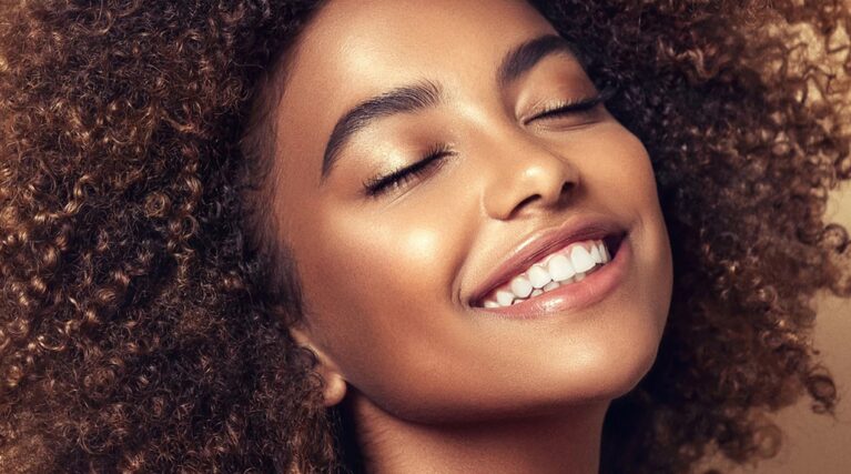 delux-woman-face Young woman with beautiful, healthy and glowing skin after led light treatment
