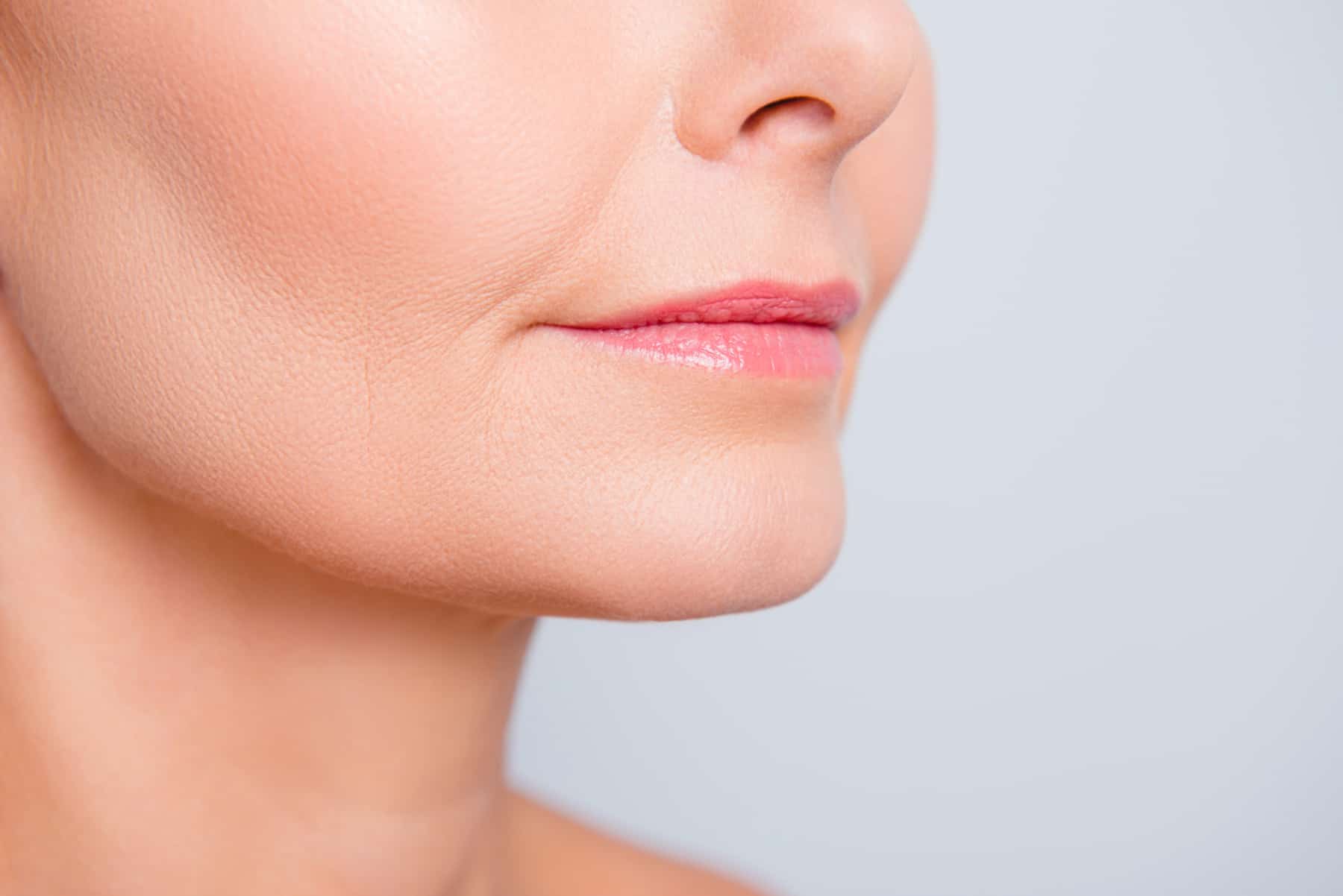 middle-aged woman with tightened skin around her chin and jowls