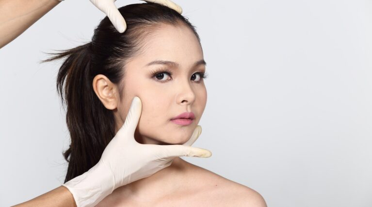 woman showing effects of texas jaw filler treatment