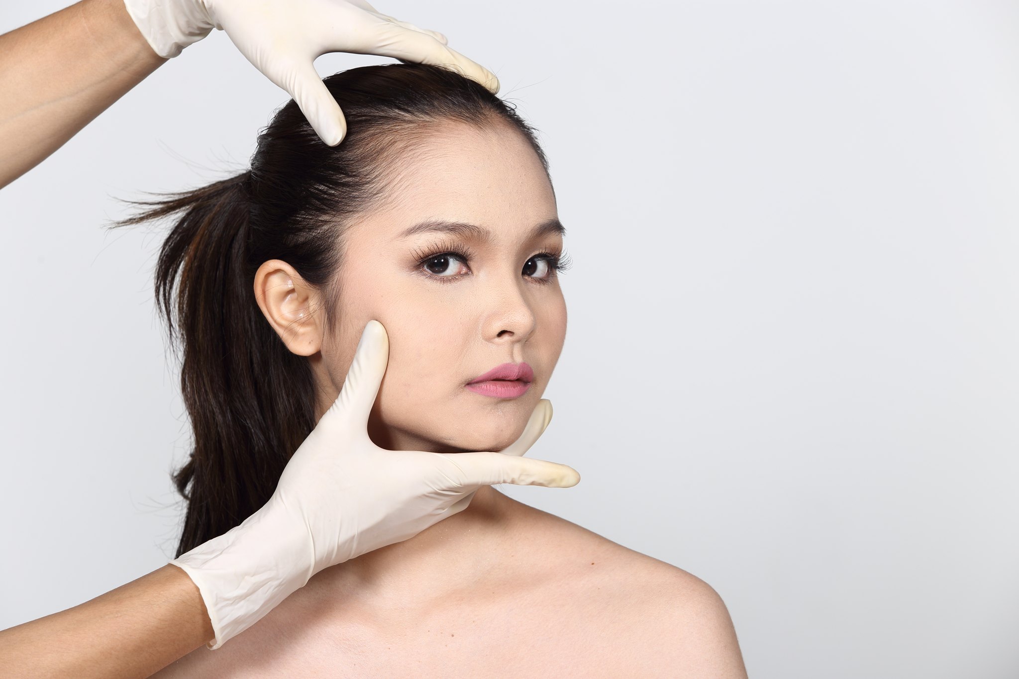 woman showing effects of texas jaw filler treatment
